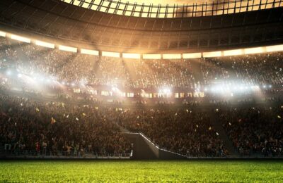 Photo of a professional soccer stadium while the sun shines. Stadium and crowd are made in 3D